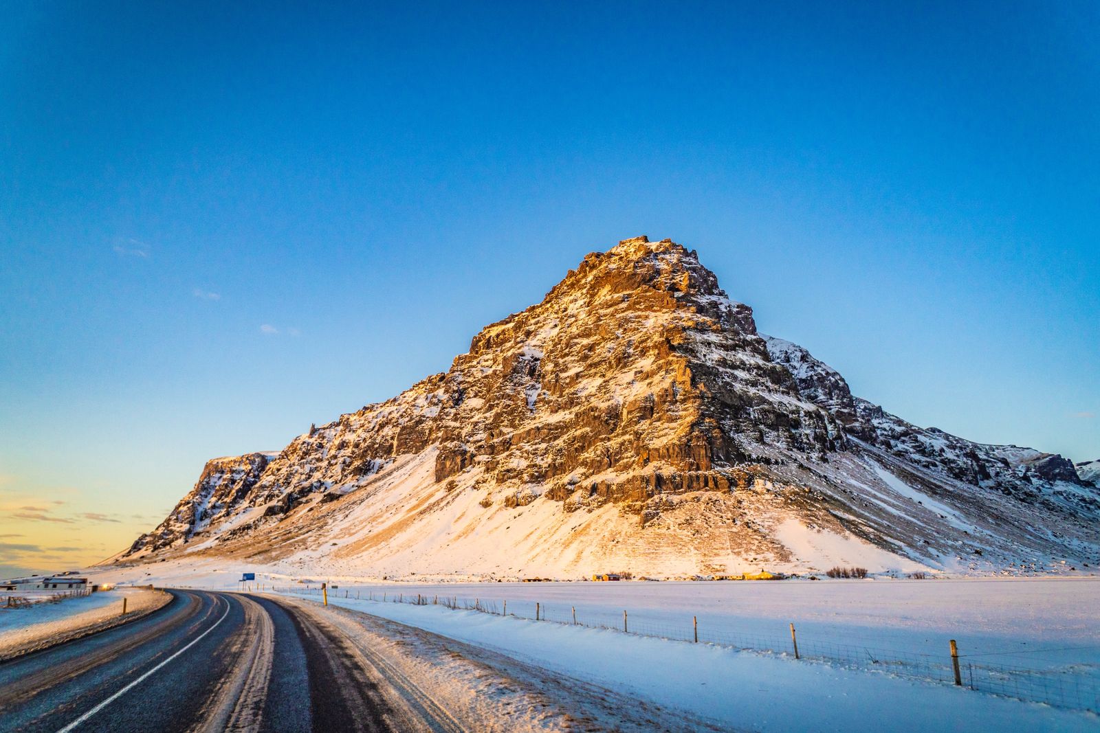 Snowed mountain and road near Vík, Iceland